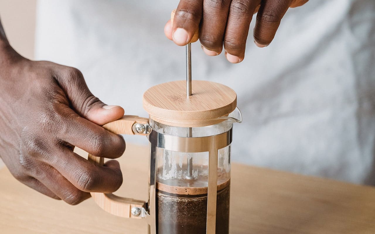 French being pressed down with coffee inside